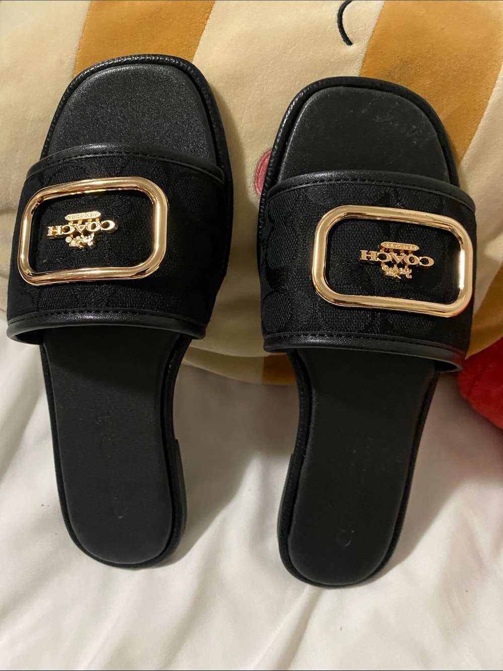 Coach Black Slide Mules with Gold Buckle Logo